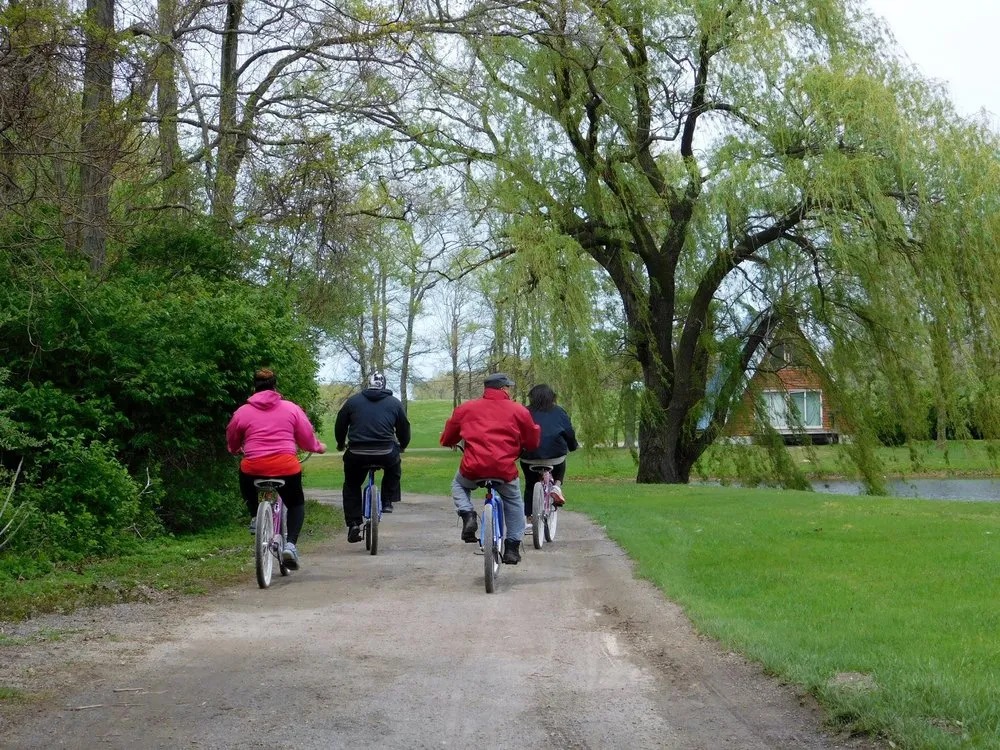 Couples taking a bike ride around Serenity Springs.