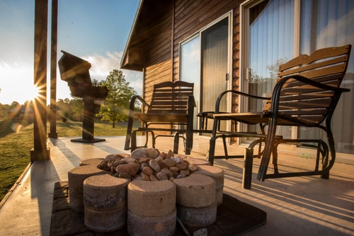 cabin back porch campfire at serenity springs