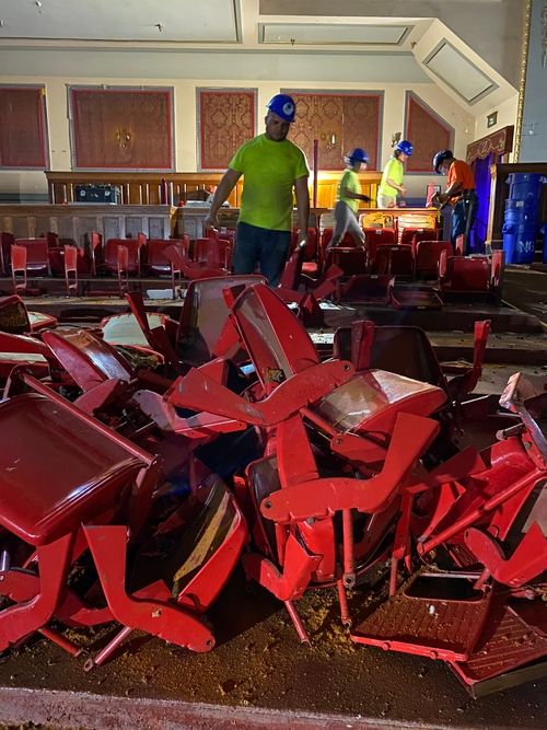 A large pile of red theater seats inside the Zeiterion theater.