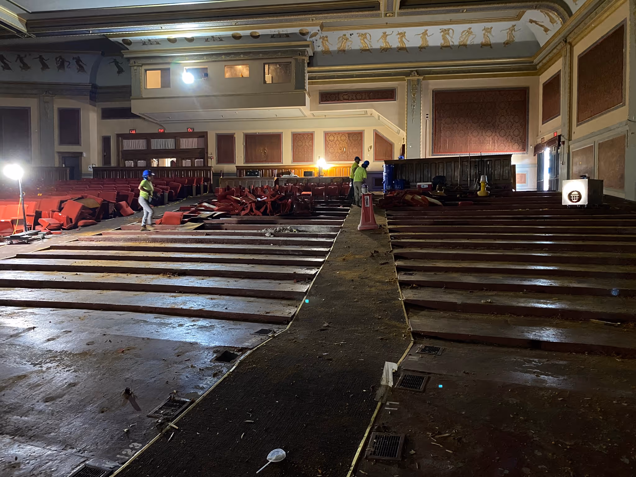 The interior of the Zeiterion theater at the beginning of construction. Half of the red seats are uninstalled from the floor piled at the back of the house. 
