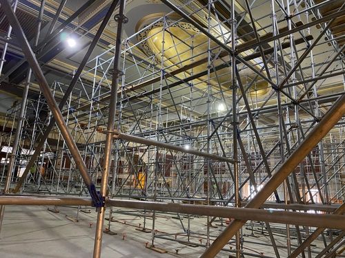 The interior of the Zeiterion Theater. The entire room is filled with metal scaffolding beams.