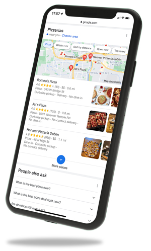 Phone with a mockup of Google local search page on the screen