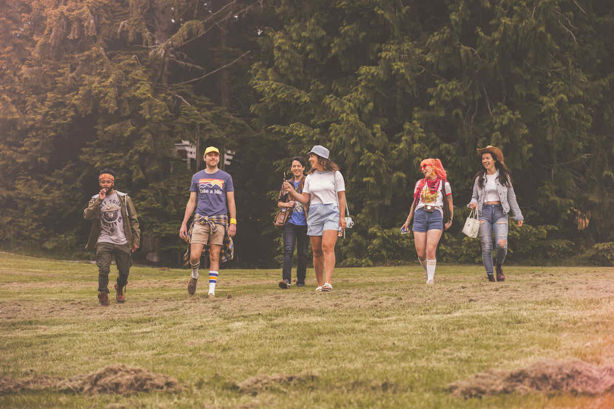 Friends walking into a meadow