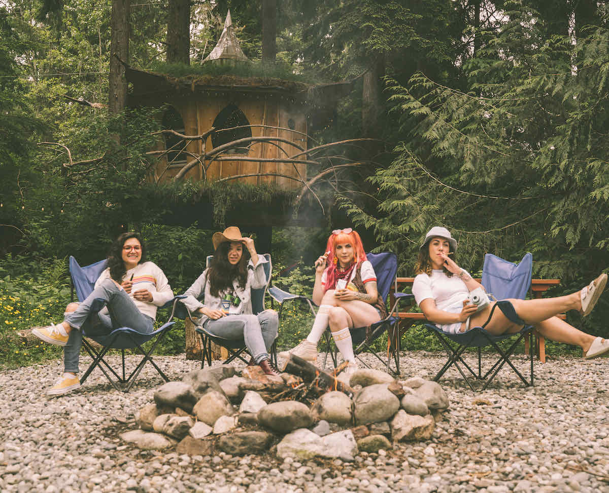 Friends sitting around a campfire