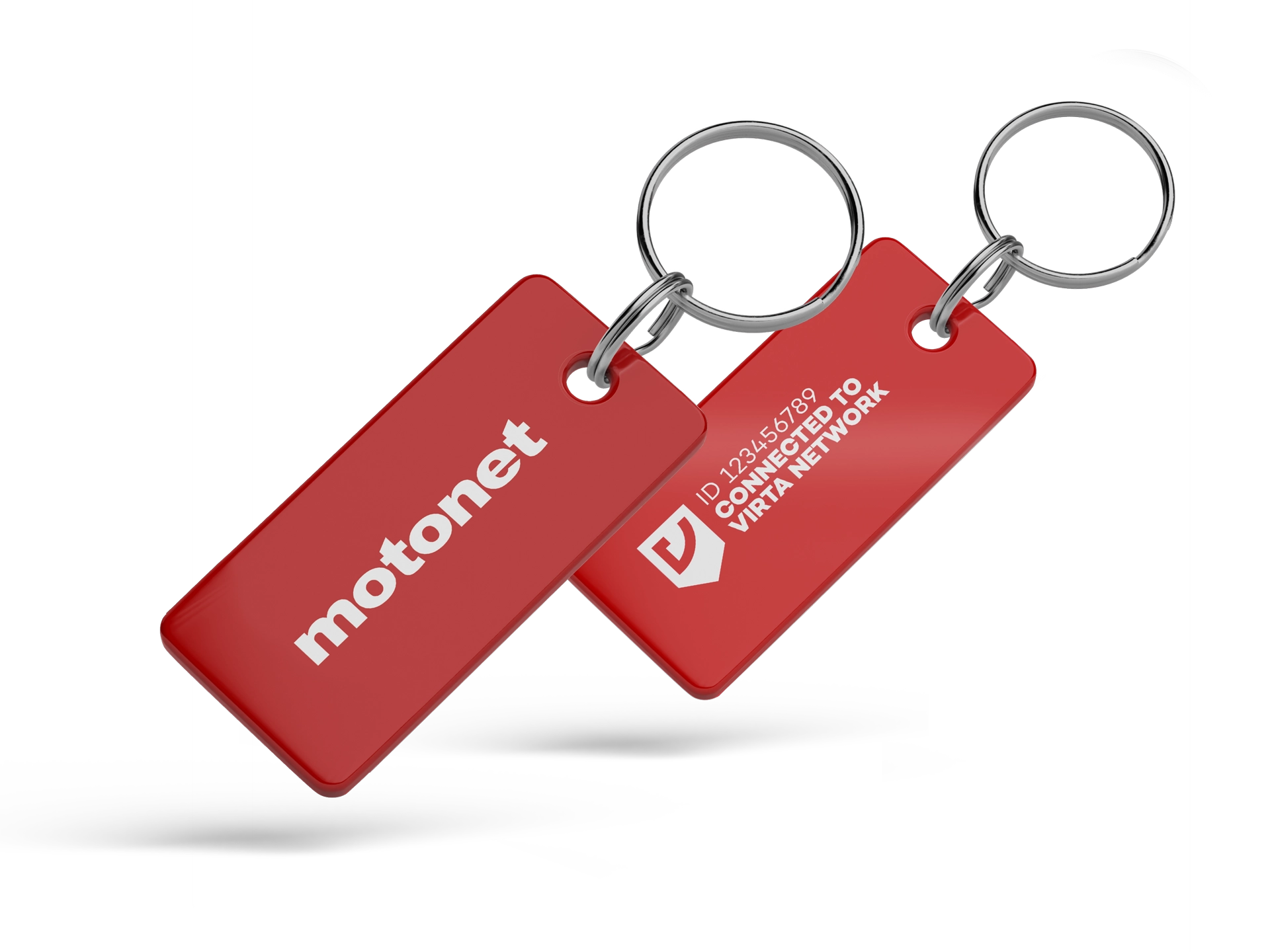 Two red key tags on metal rings, one labeled 'motonet' and the other 'ID 123456789 connected to Virta network'.