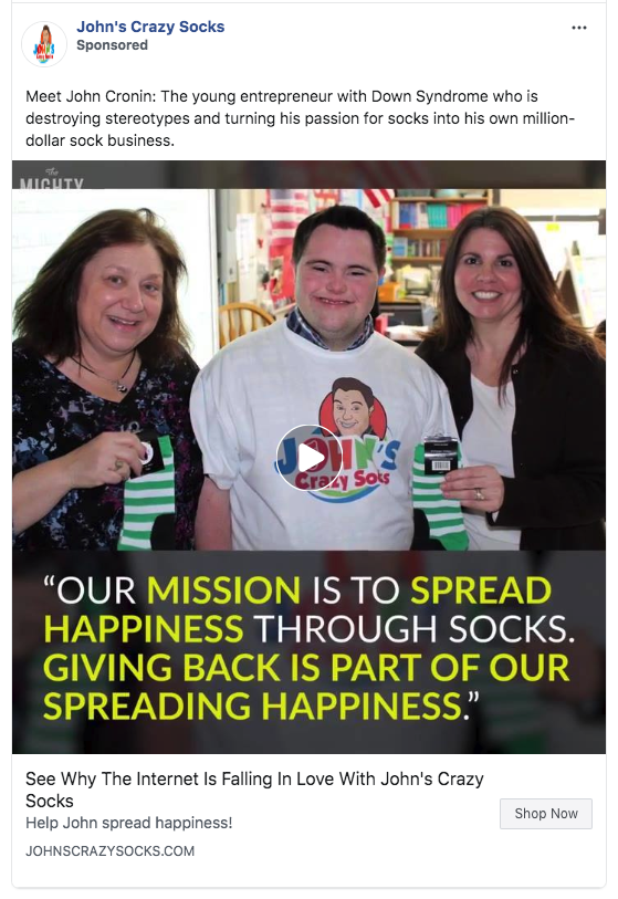 A Facebook advertisement for John's crazy socks. It's a video ad that highlights the mission of the company and the different charities they support. 'Giving back is part of our spreading happiness.'