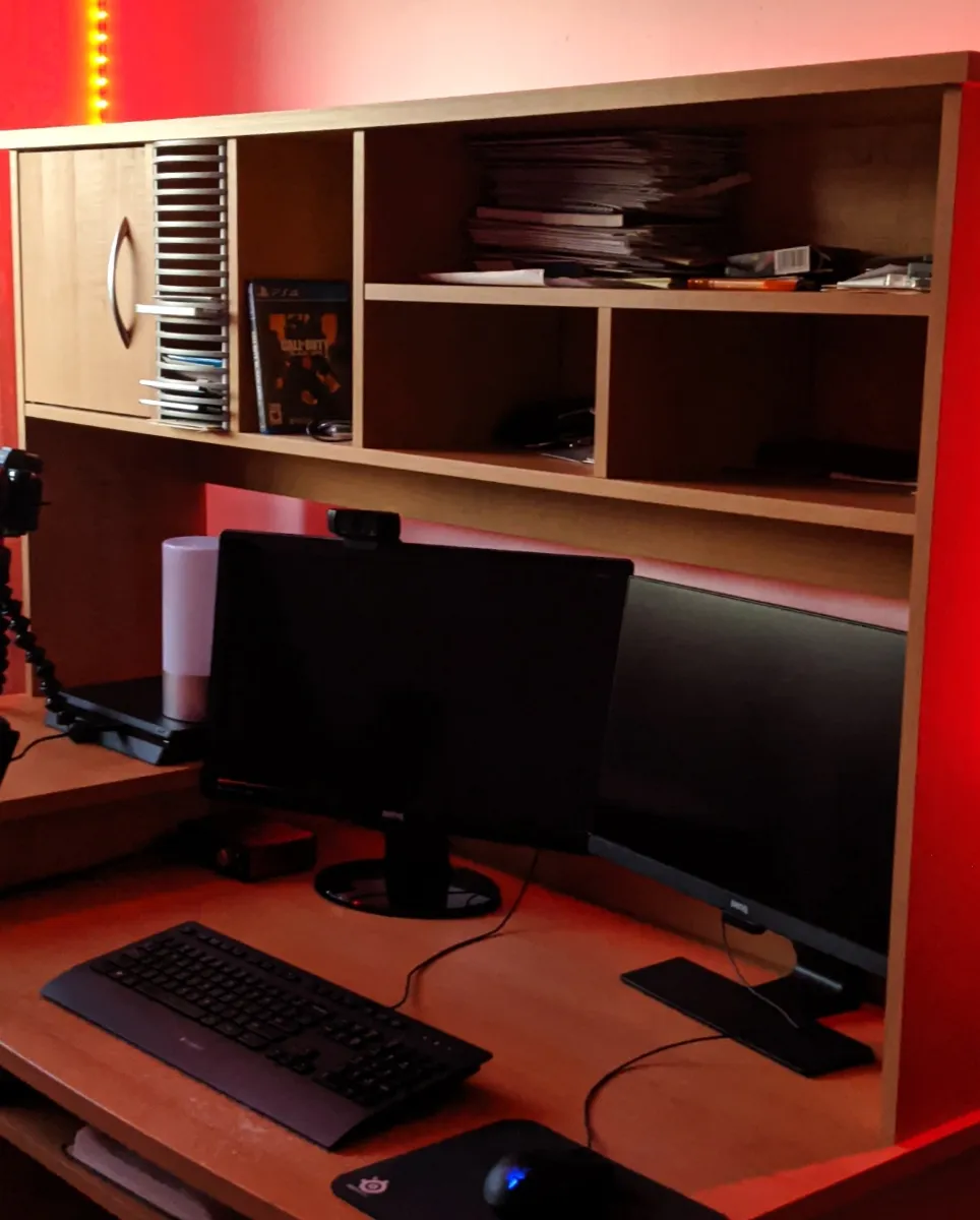 Vinit's office setup with red LED lights shining over a 2 monitor setup