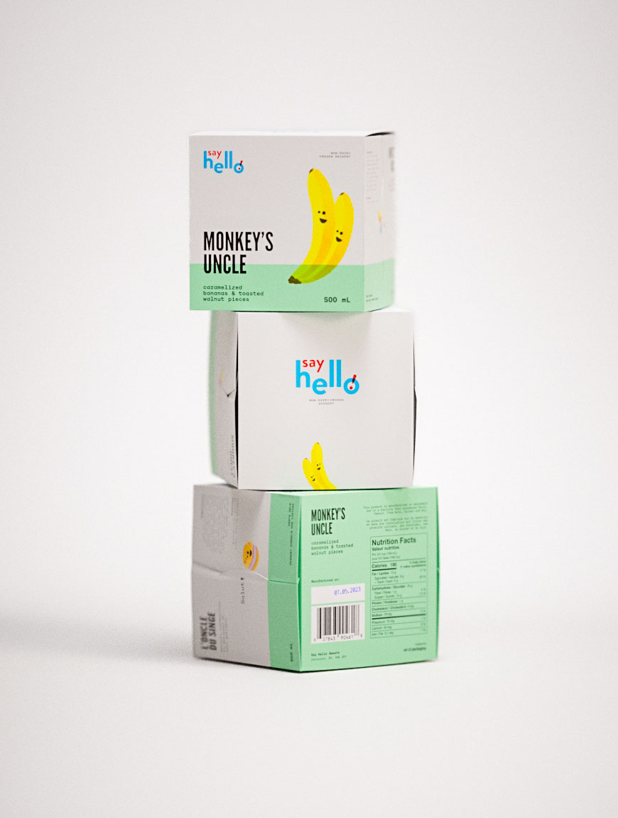 Two cartoon bananas beam across the front face of the “Monkey’s Uncle” carton, their curved forms printed in vibrant Pantone yellow atop a pastel-mint strip—an example of custom design packaging directed by a creative packaging design agency. Clean black text, barcode and nutrition grid line the sides, while innovative packaging solutions and unique packaging ideas for small e-commerce brands inform the tidy layout. The stack of boxes sits in soft studio lighting, highlighting eco-friendly packaging materials Canada suppliers often tout.