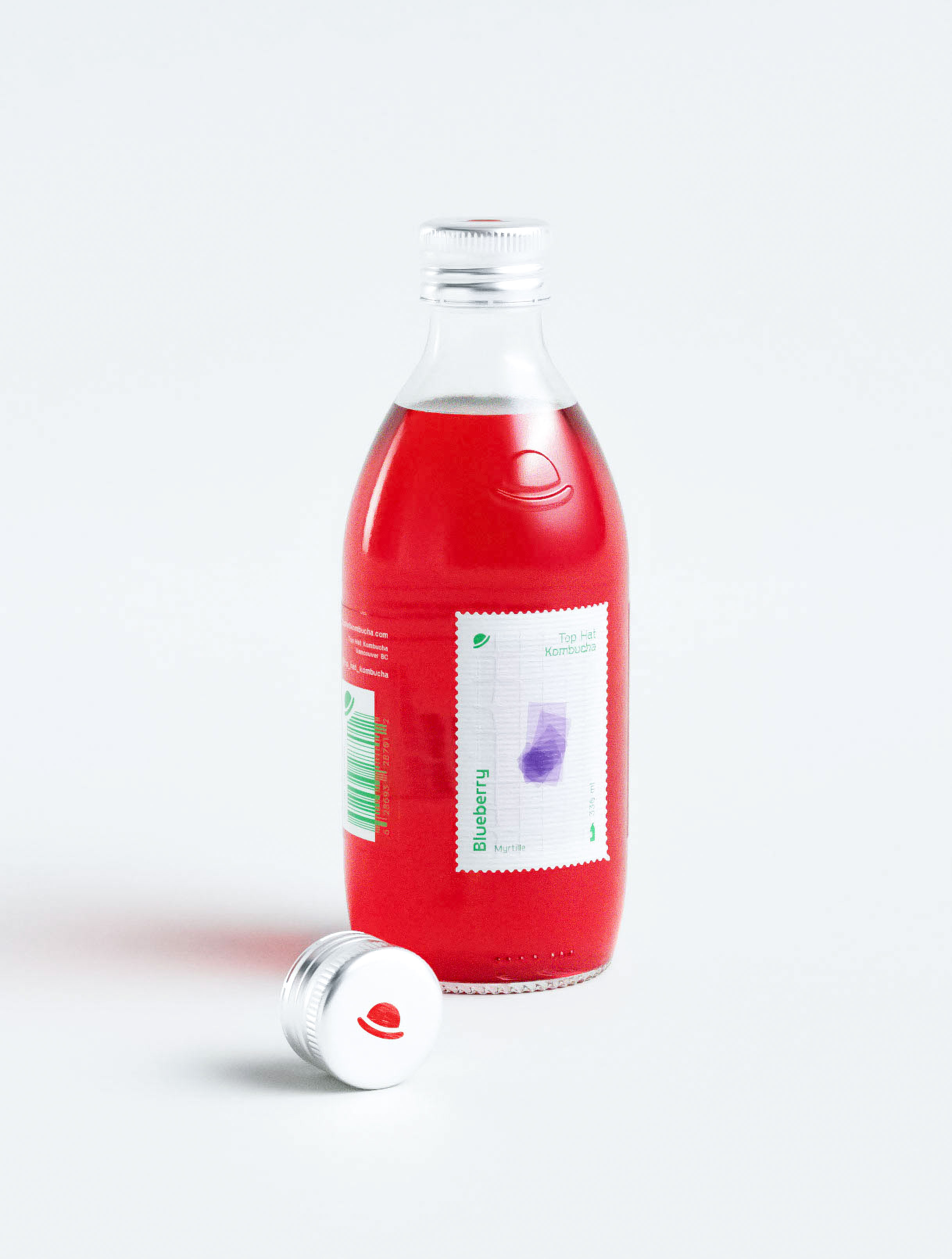 Strategic packaging design for blueberry kombucha utilizing postage stamp visual language to communicate premium artisanal positioning and ingredient authenticity. Creative design studio portfolio showcasing innovative label architecture with stamp element as hero graphic creating instant shelf recognition. Professional branding agency work demonstrating expertise in fermented beverage packaging through unique visual metaphor combining nostalgia with contemporary health food aesthetics for memorable consumer engagement.