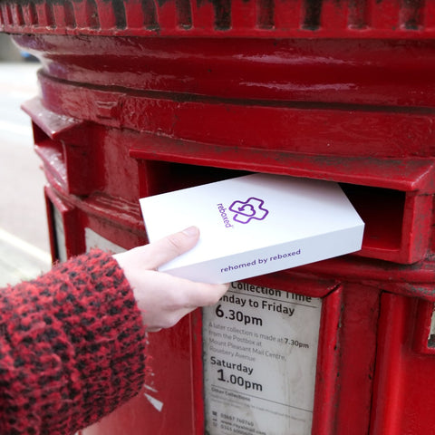 reboxed phone being posted into a letterbox