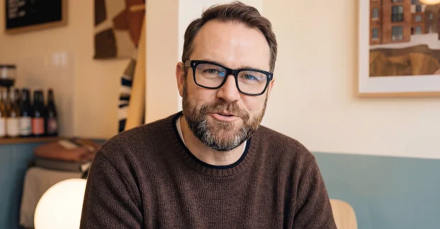 Close-up of a hyperrealistic AI Avatar presenter speaking naturally to the camera.