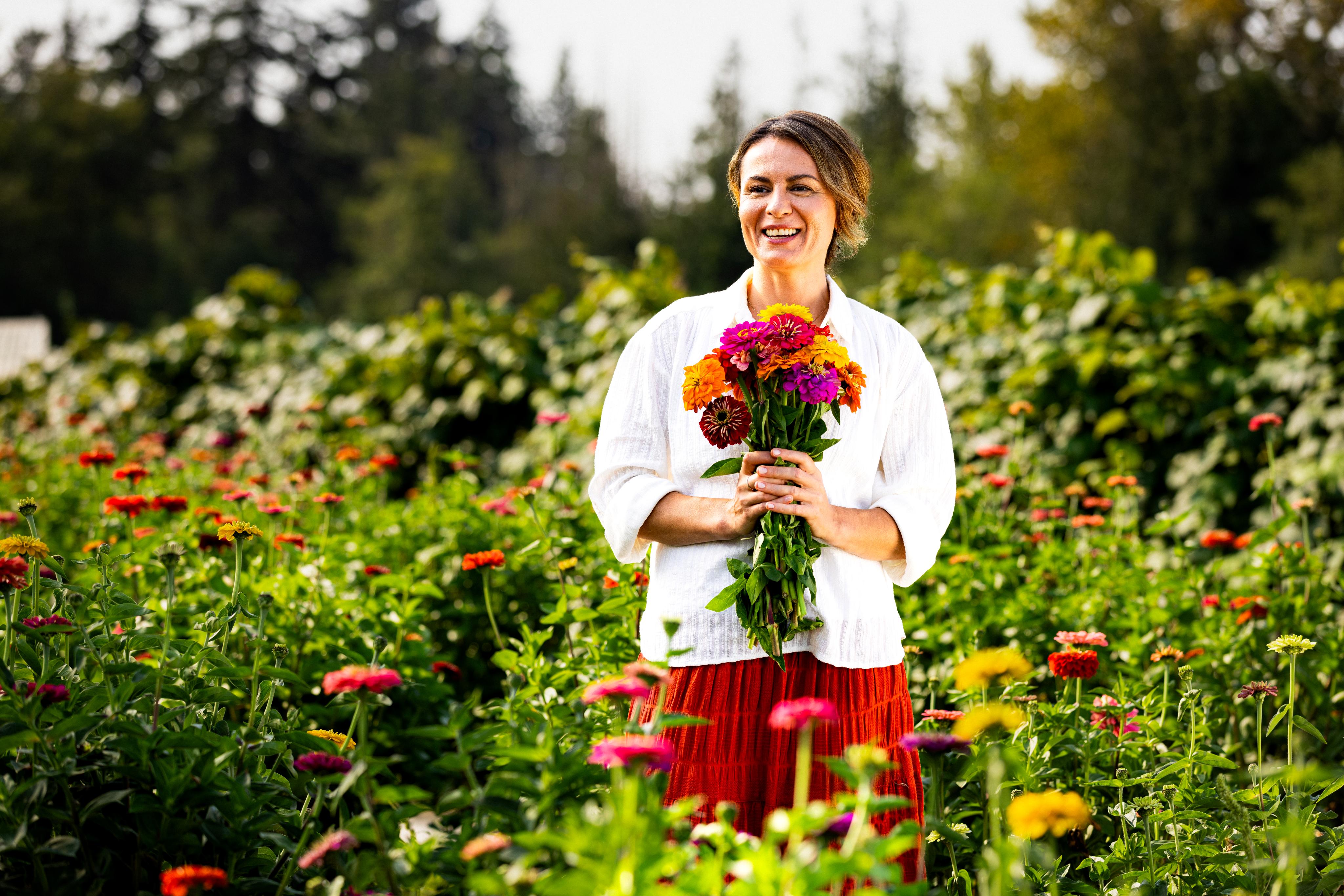 Woman standing in flower field