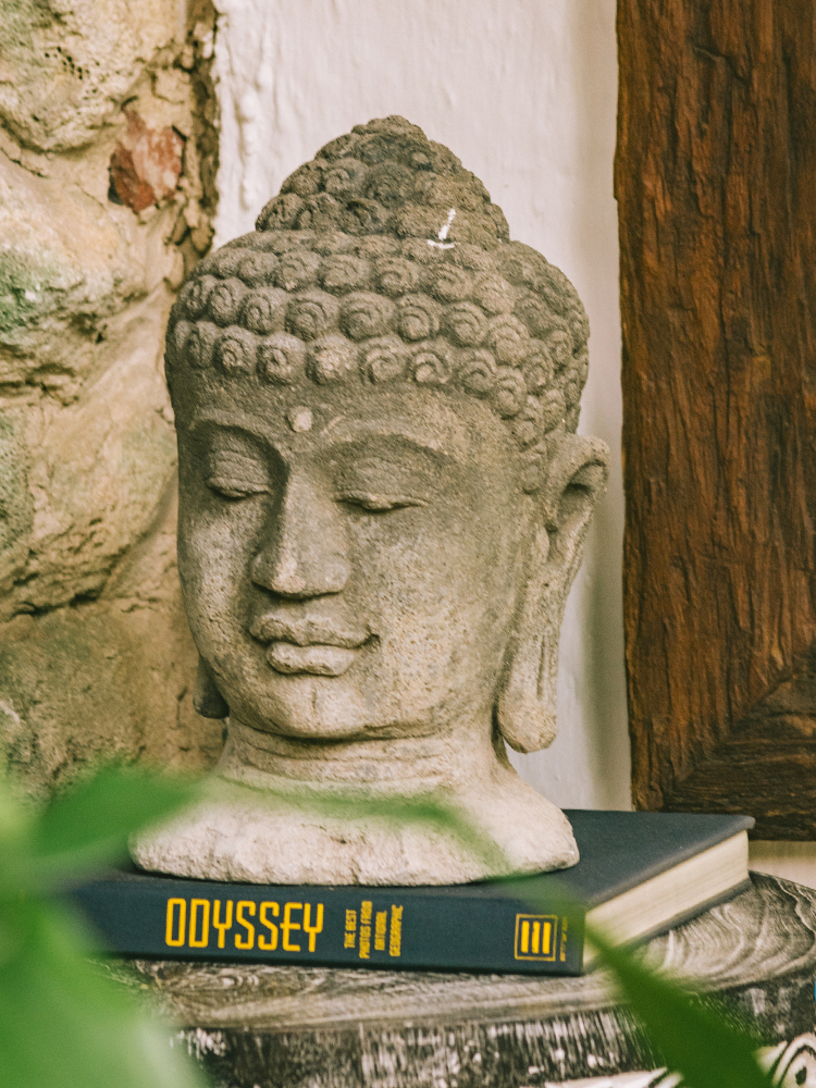 Stone sculpture Buddha head, light gray
