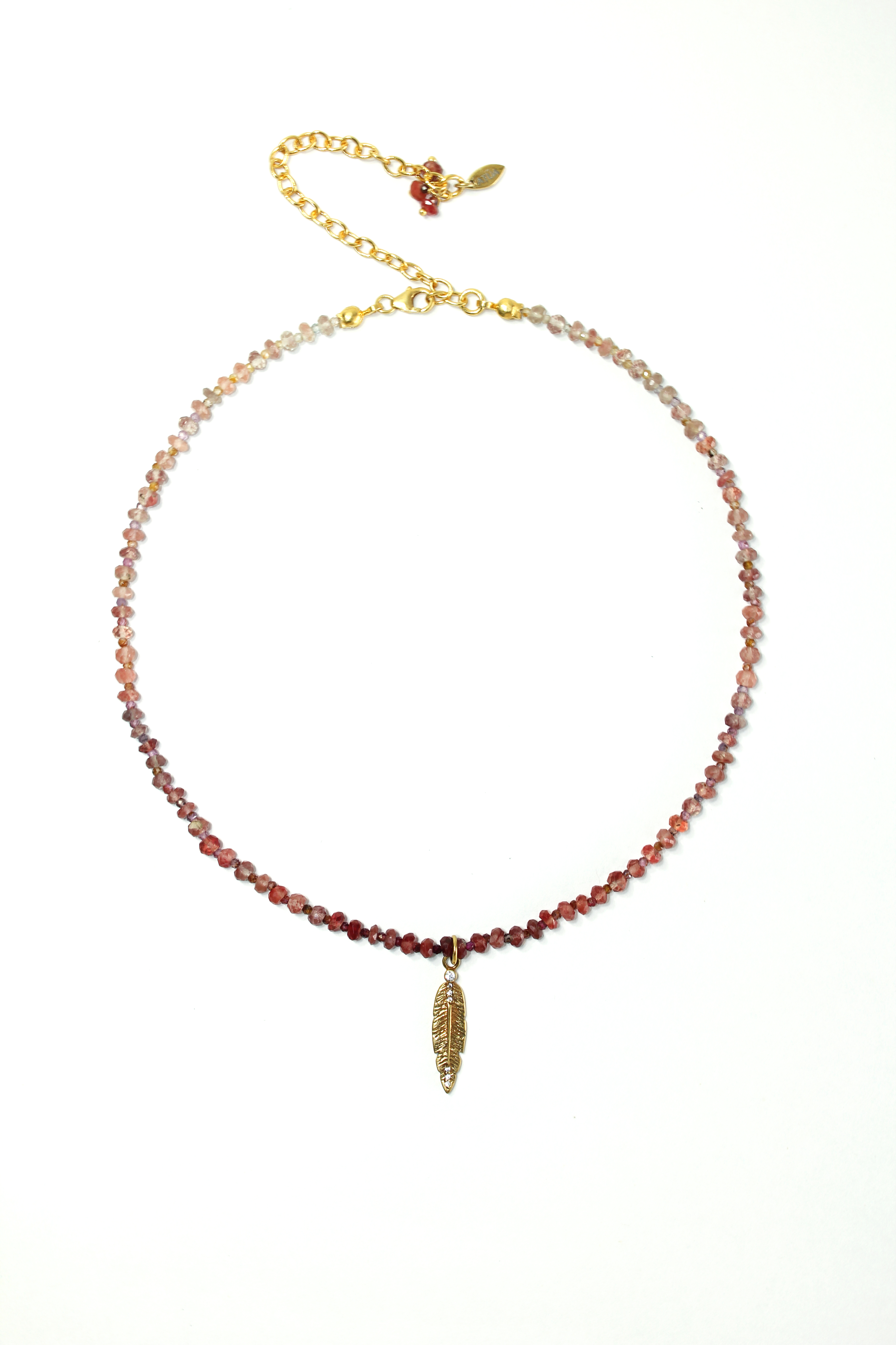 Necklace with andesian sapphire feather in gold plated silver.