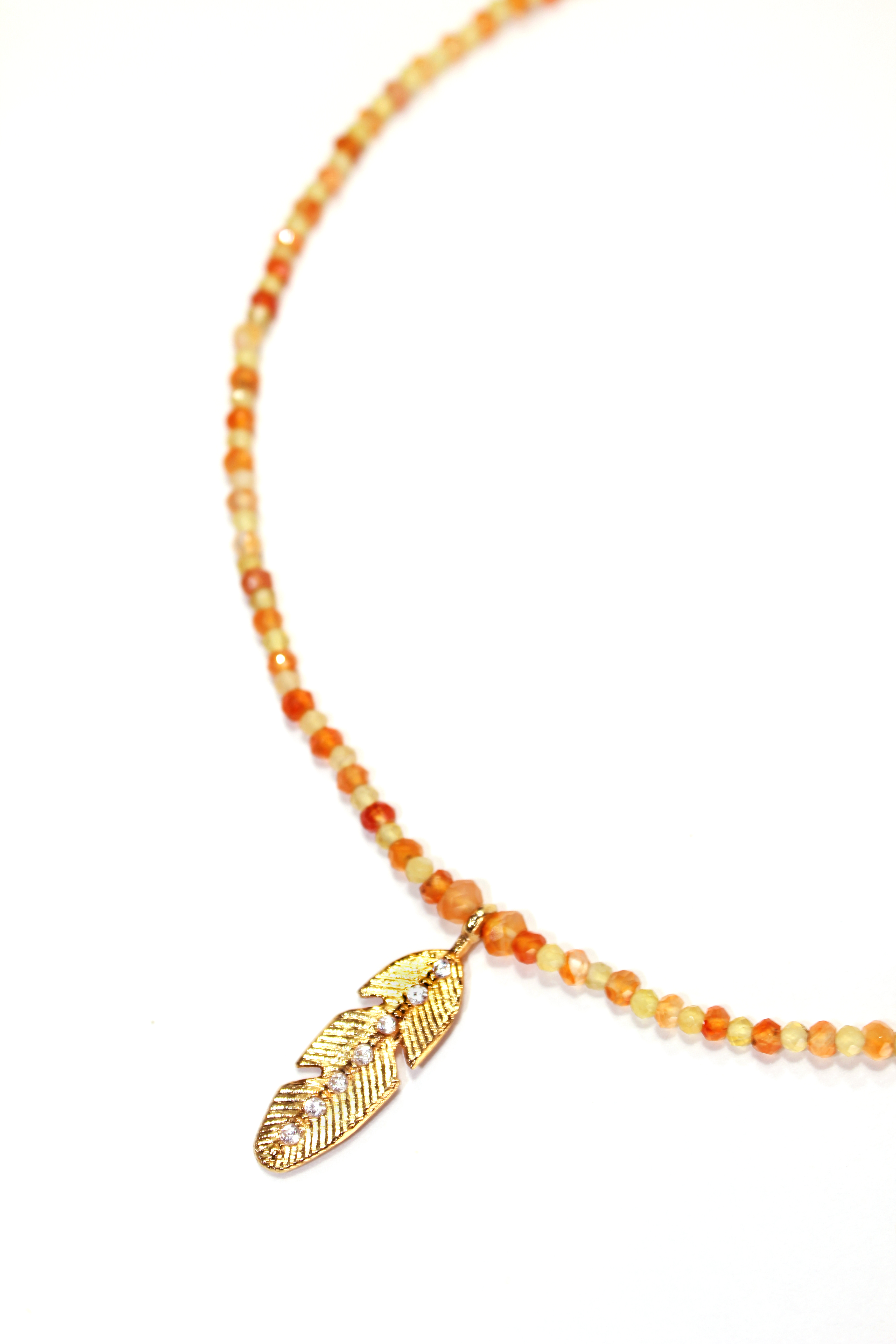 Necklace with yellow opal and carnelian feathers in gold plated silver.