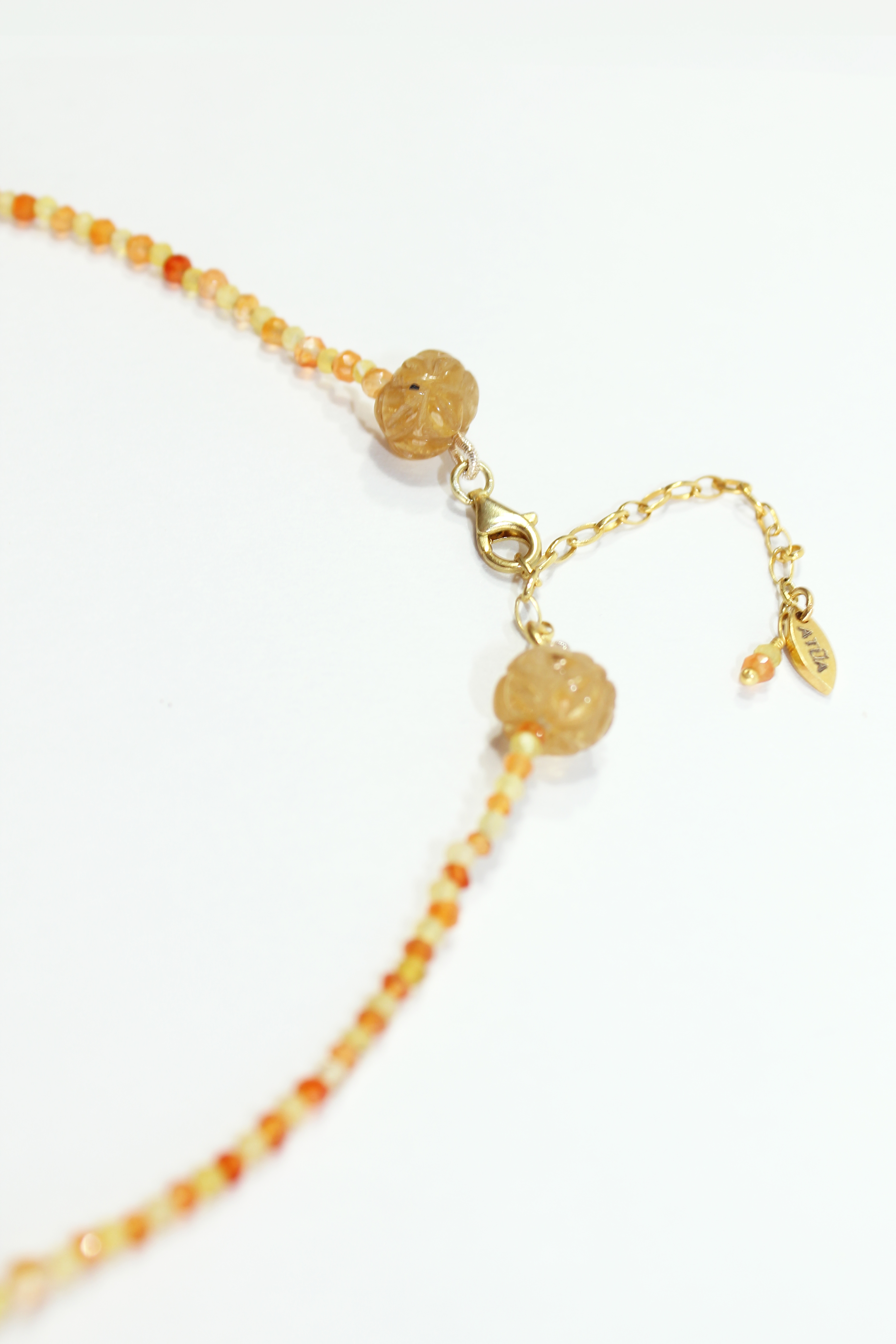 Necklace with yellow opal and carnelian feathers in gold plated silver.