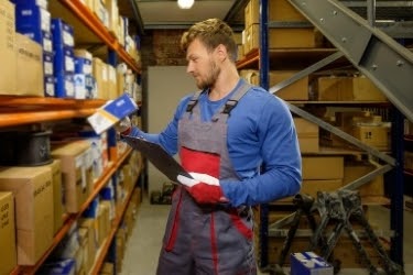 Man picking a box from the warehouse.