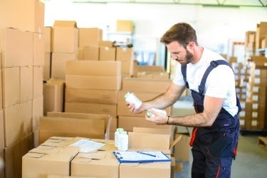 Man confused looking at two similar products