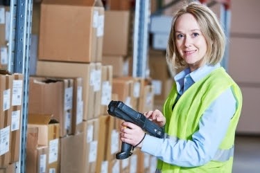 Woman holding a Warehouse Management System scanner