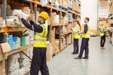 People working at a warehouse picking products.