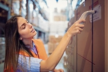 Woman scanning a batch of product