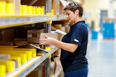 Woman employee picking merchandise