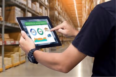 Man using warehouse management software