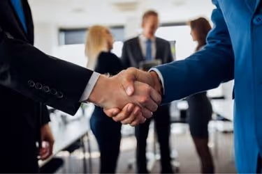 Business handshake with partners