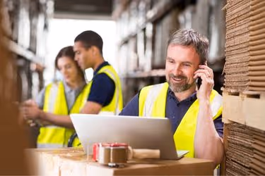 Warehouse employees communicating