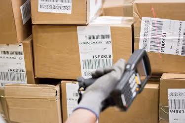 Worker scanning boxes