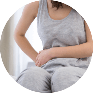 image of female holding her stomach