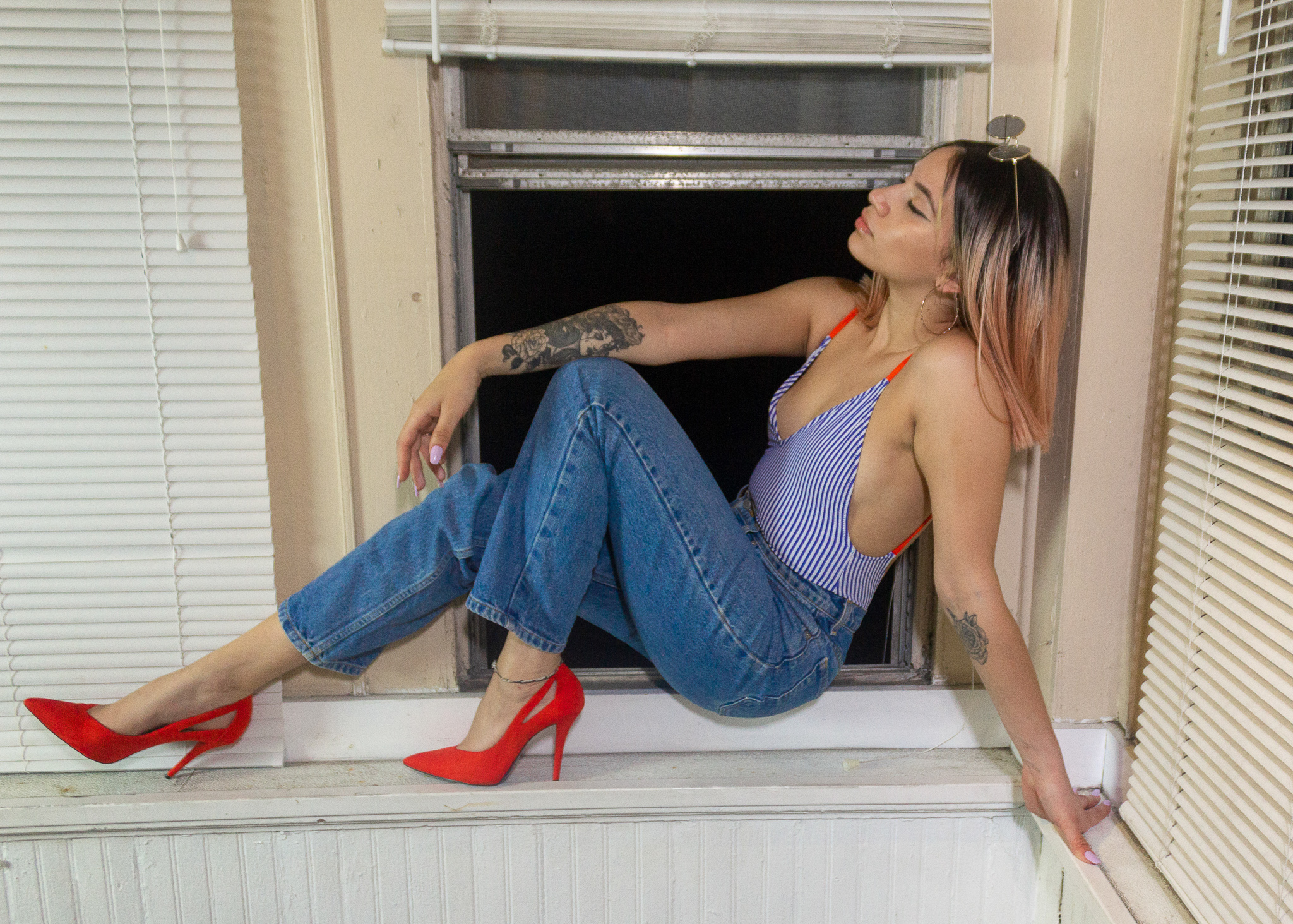 model sitting on ledge for editorial photoshoot 