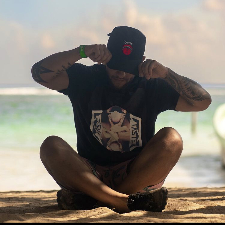 Male model posing with hat for clothing company. 