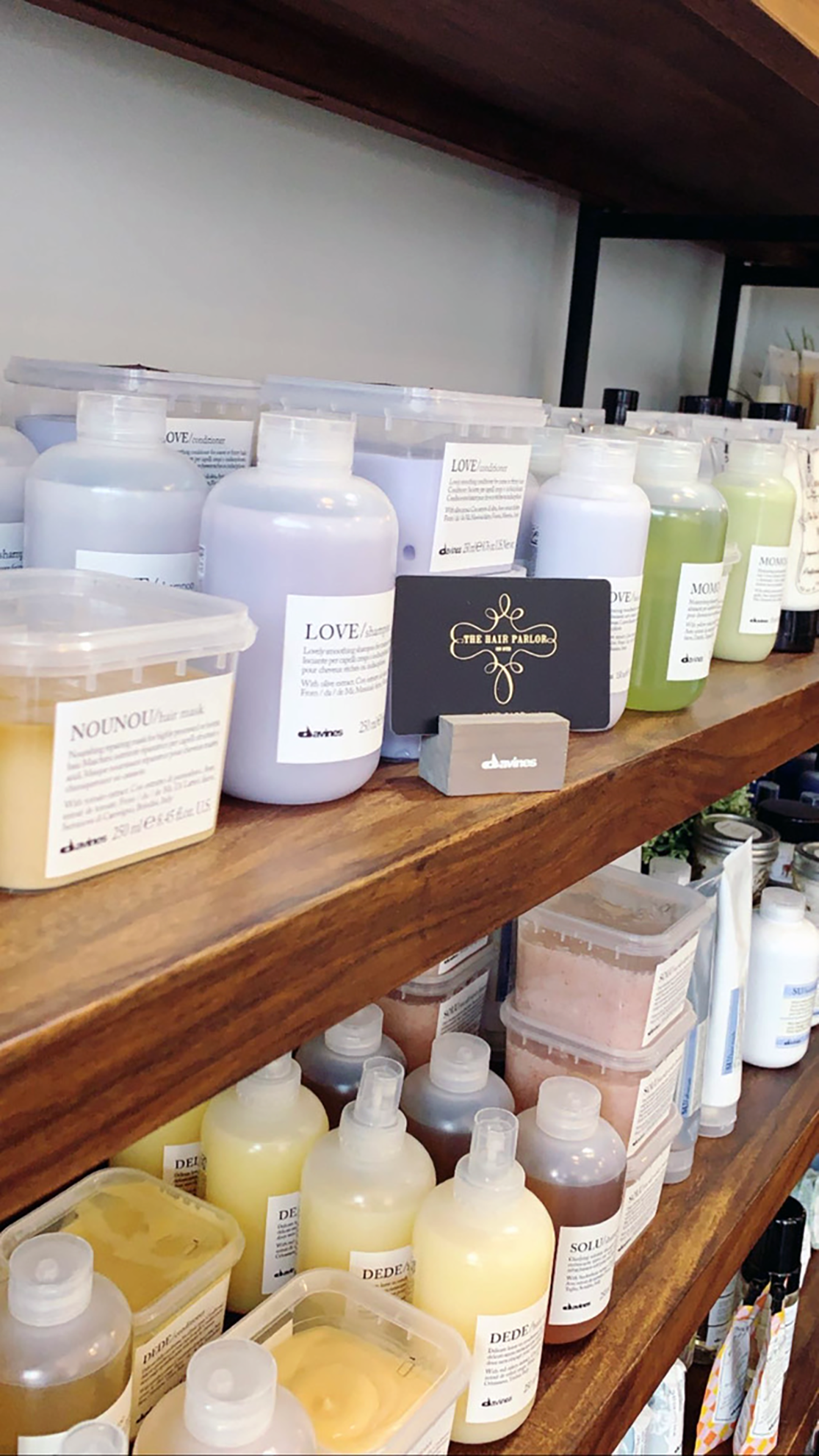 Davines Hair Care lines our shelves. Fully stocked and eco-friendly pacakaging. 100%.