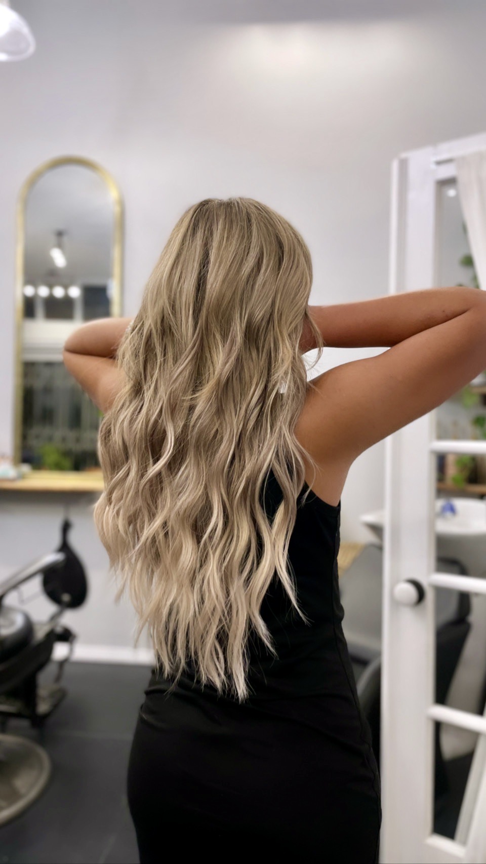 This blonde color and Bellami hair extensions by Sophie Davies, Owner/Stylist.