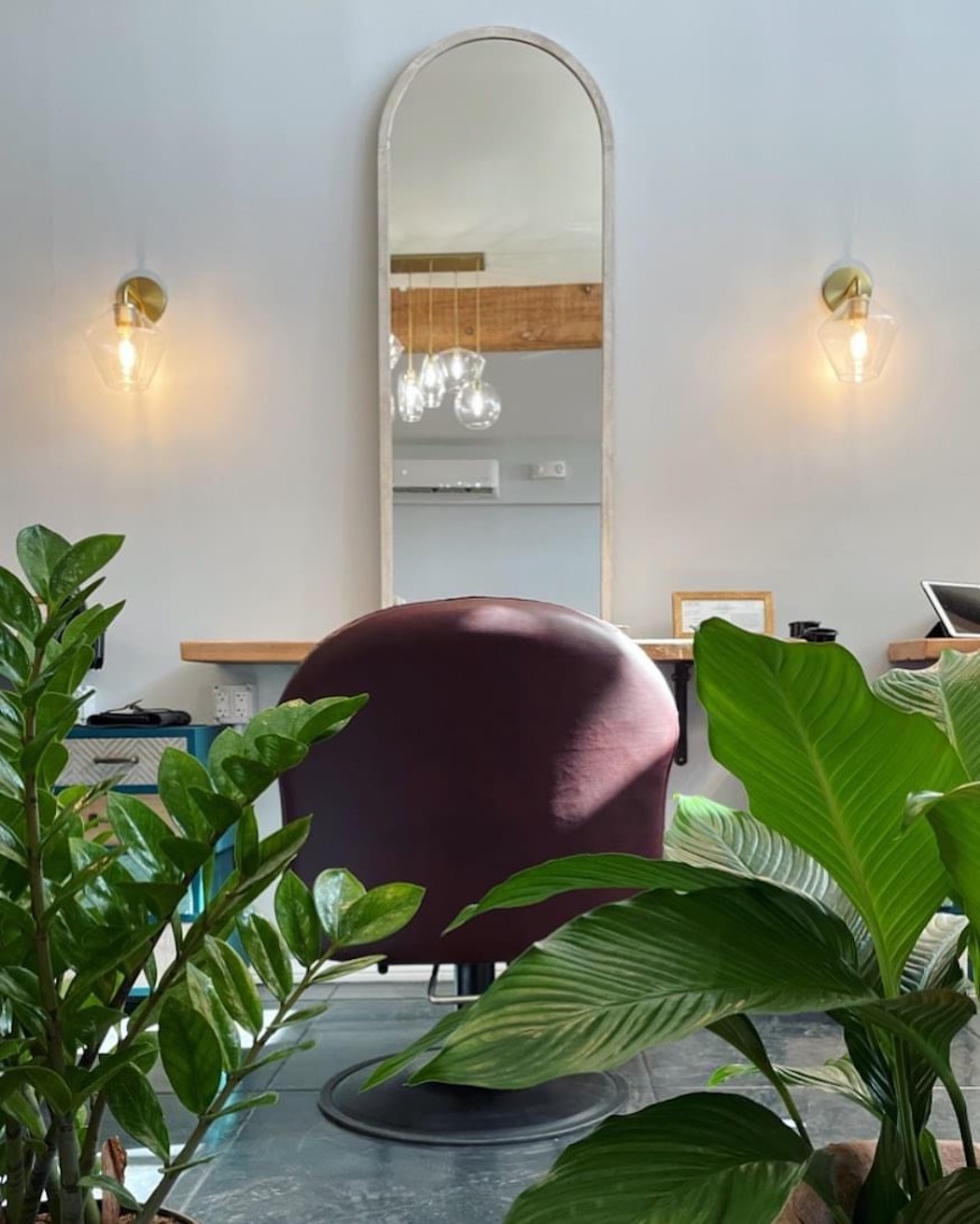 Our beautiful salon entrance and styling station. Private and spacious, with rehabbed warm wood ...