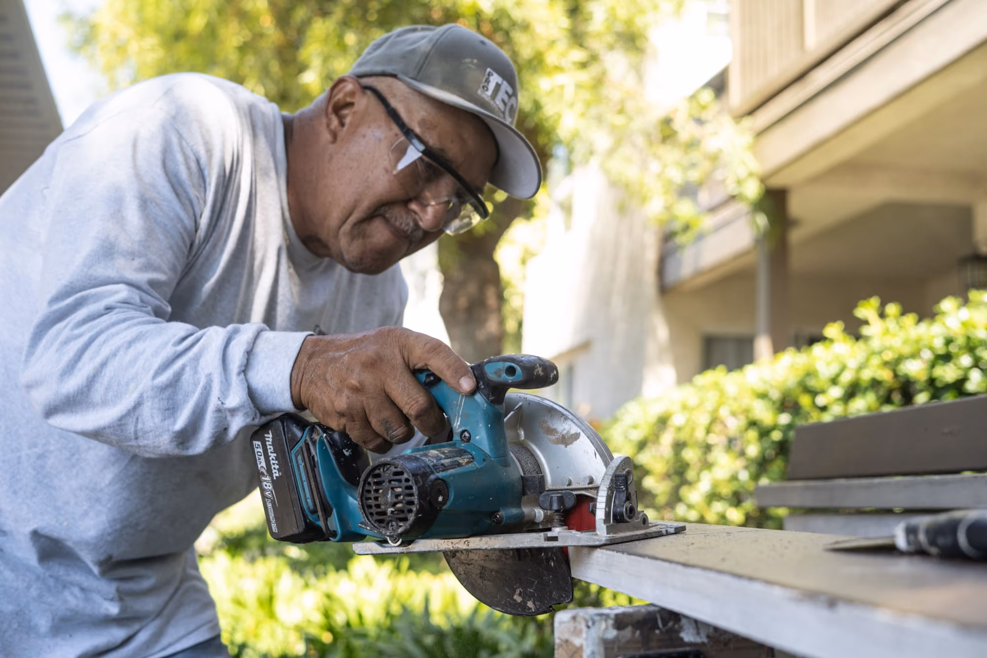 protec worker with a tool
