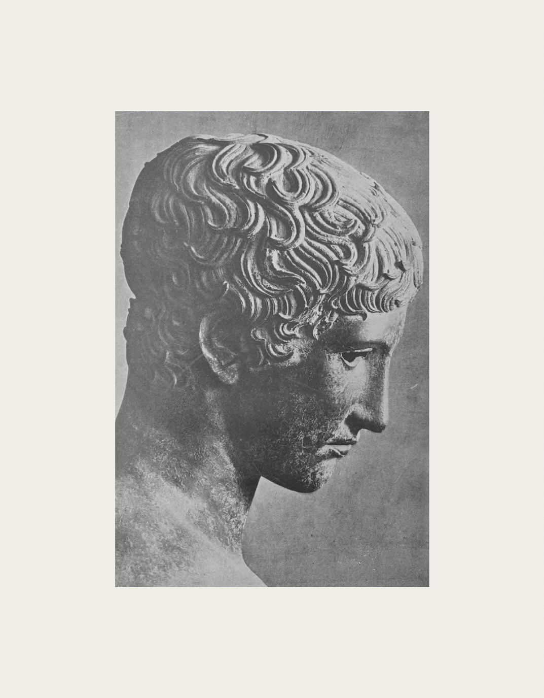 A classical Greek sculpted head in profile, a weathered reference photograph on a beige mount.
