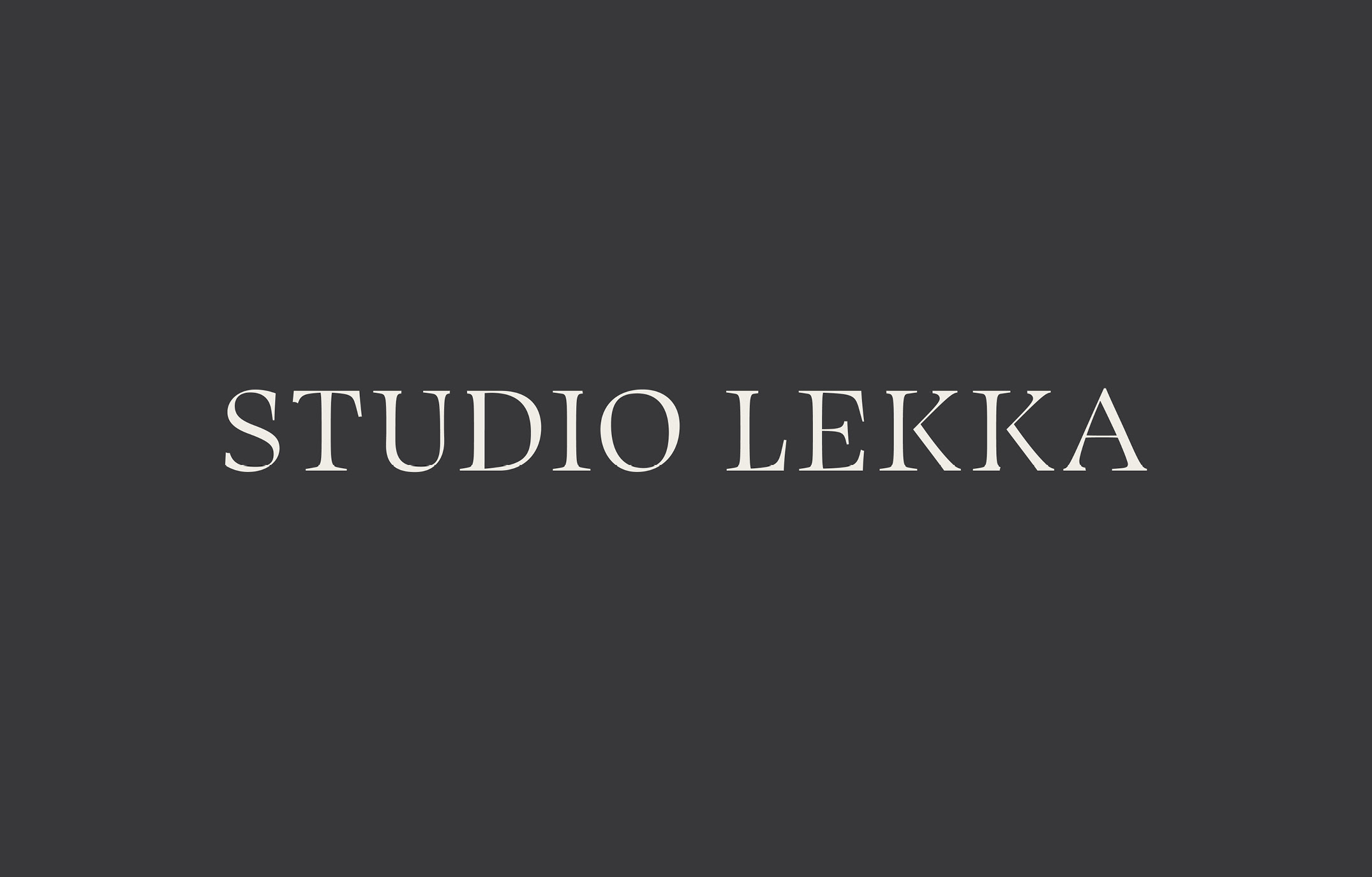 The final Studio Lekka wordmark, cream on charcoal, drawn from a modified Swear Display.