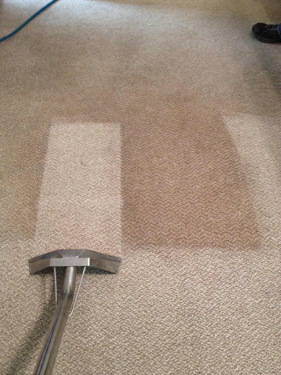 vacuum going across carpet with clean strick