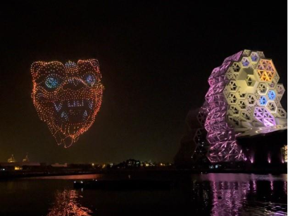 A large building with lights at nightAI-generated content may be incorrect.