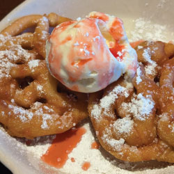 Funnel Cake with stawberry drizzle
