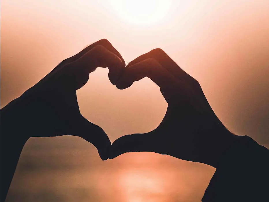 hand-heart-sunset