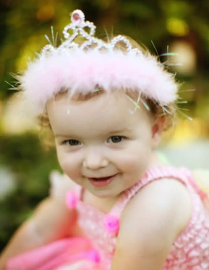 baby girl wearing fluffy pink tiara