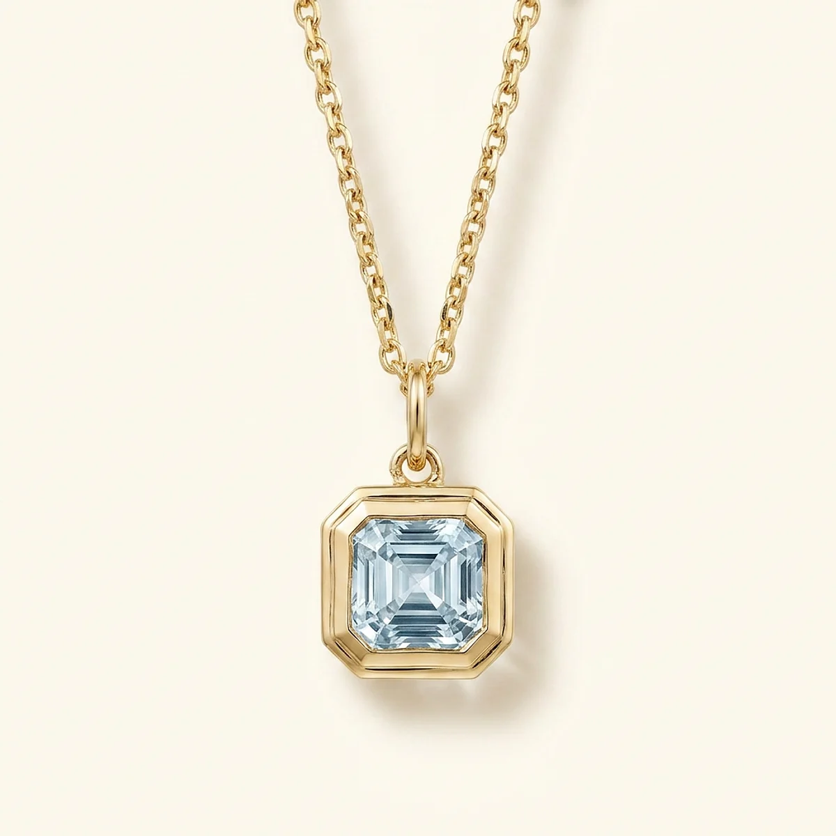 A 2ct blue asscher diamond on a yellow gold pendant, custom-designed by Eterneva to honor the remarkable Coco.