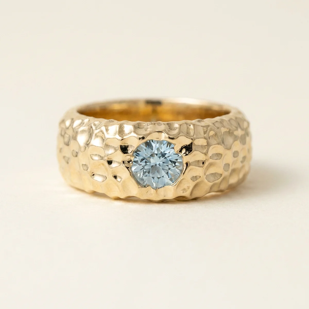 A .5ct blue round diamond on a yellow gold ring, custom-designed by Eterneva to honor the remarkable Rusty.