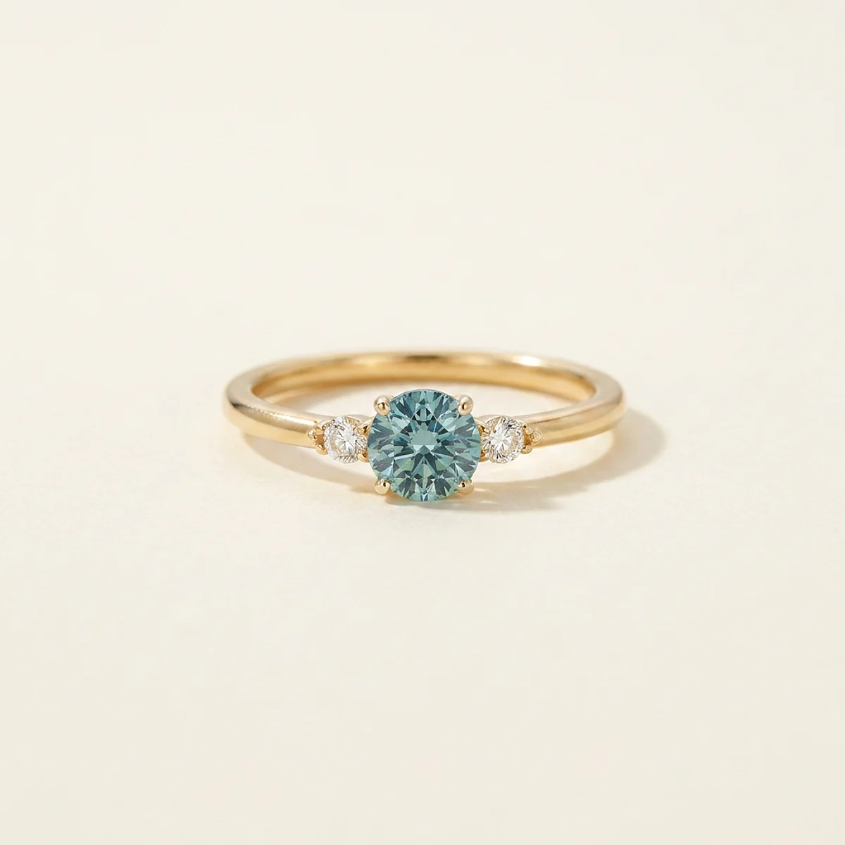 A .5ct blue round diamond on a yellow gold ring, custom-designed by Eterneva to honor the remarkable Lily.