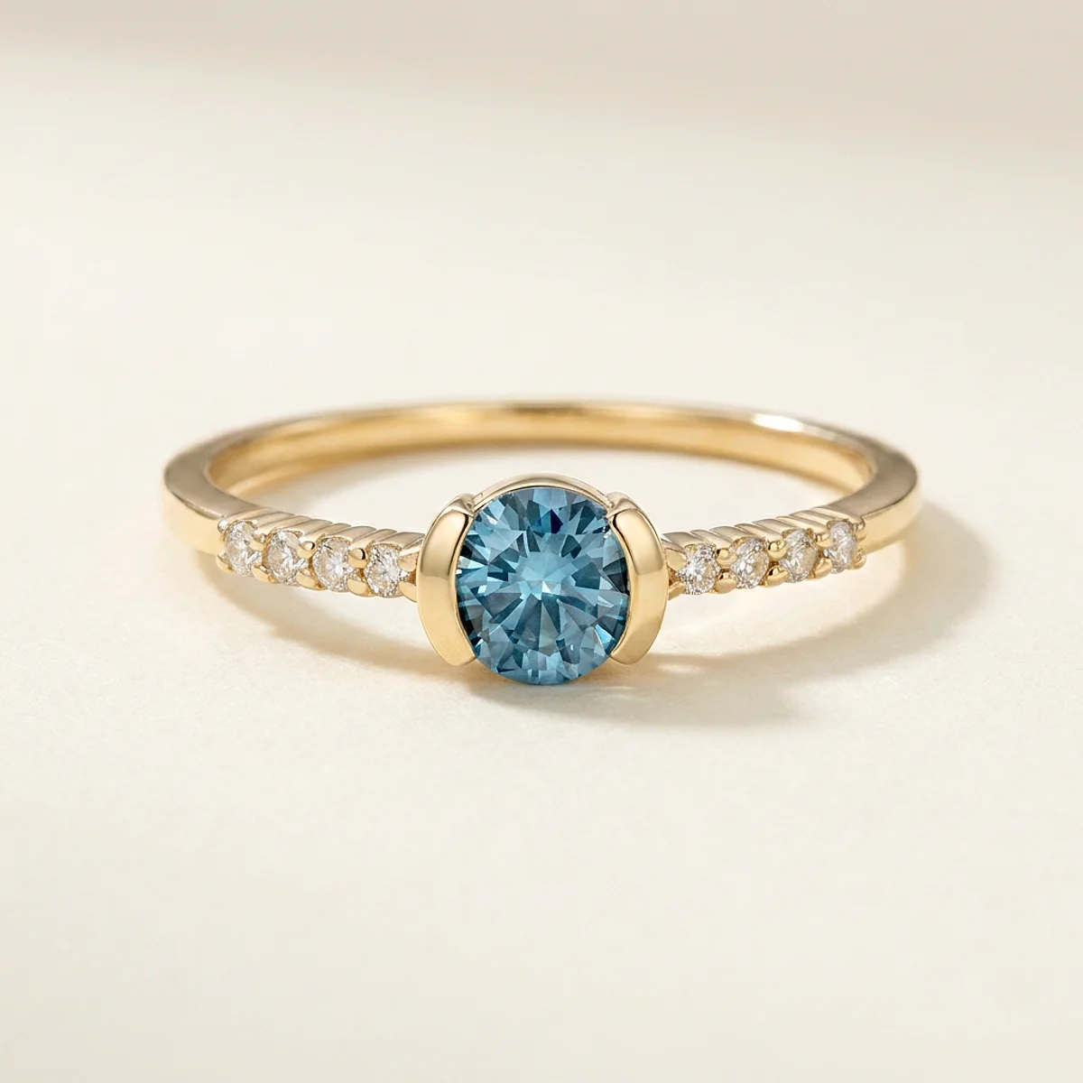A .4ct blue round diamond on a yellow gold ring, custom-designed by Eterneva to honor the remarkable Ronnie.