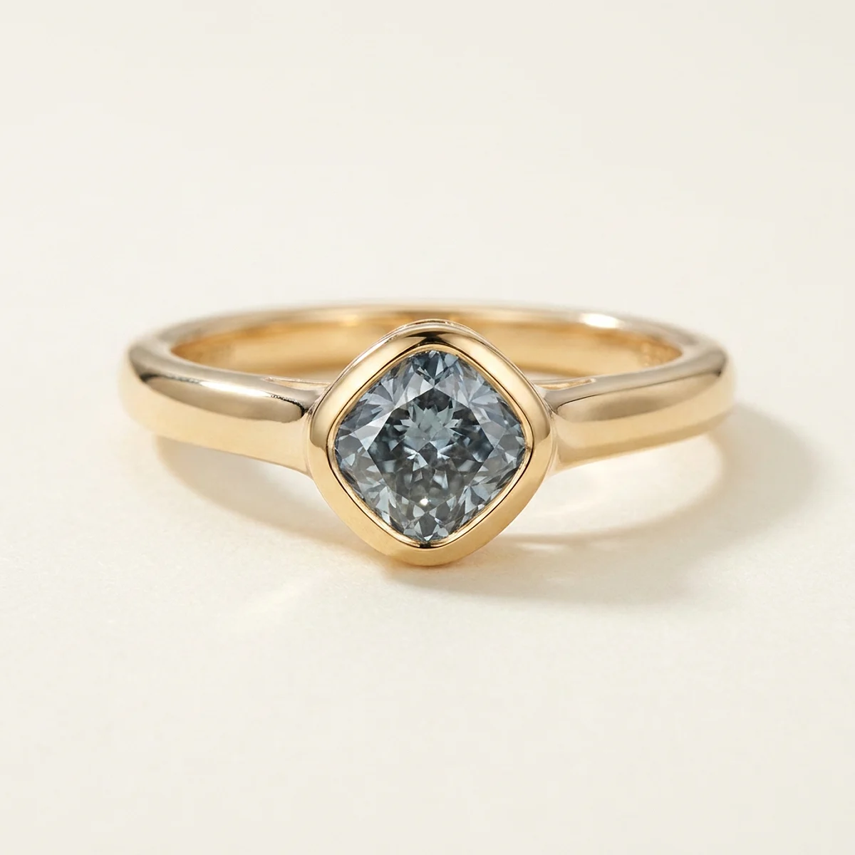 A .5ct blue cushion diamond on a yellow gold ring, custom-designed by Eterneva to honor the remarkable Kyle.