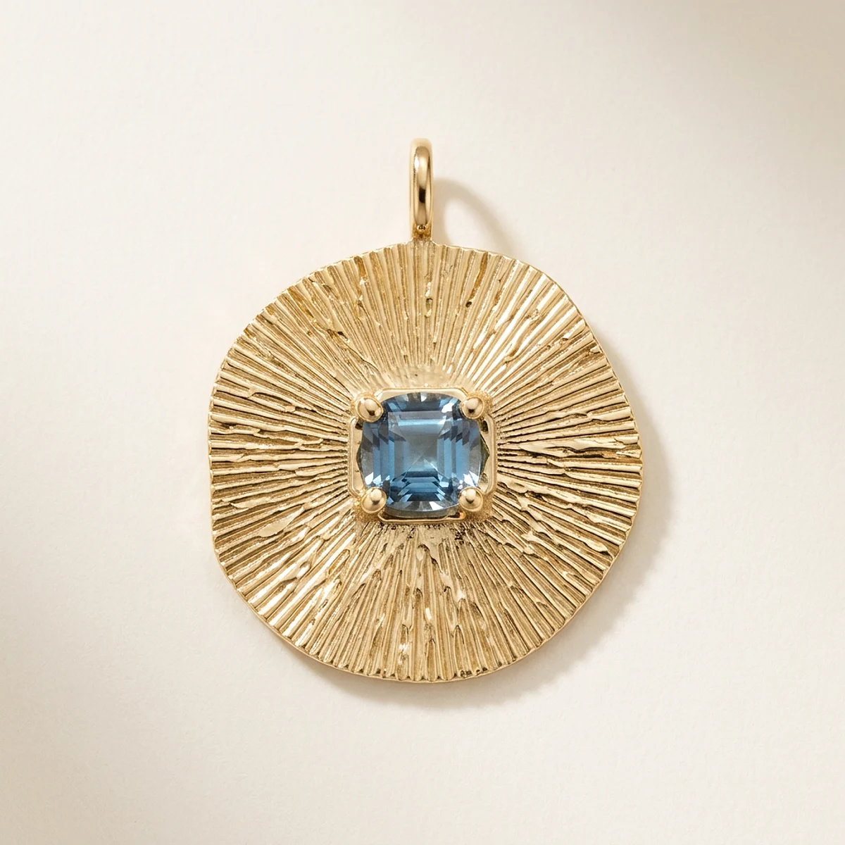 A .25ct blue rough diamond on a yellow gold pendant, custom-designed by Eterneva to honor the remarkable Curtis.